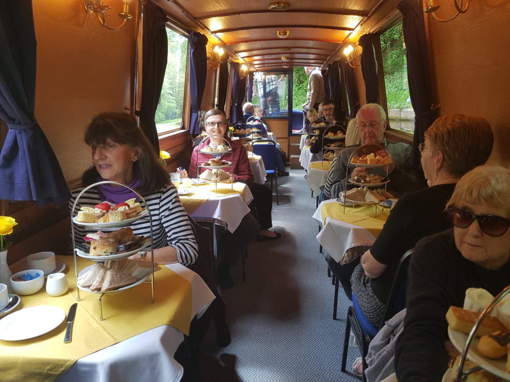 Enjoying afternoon tea on a canal boat trip